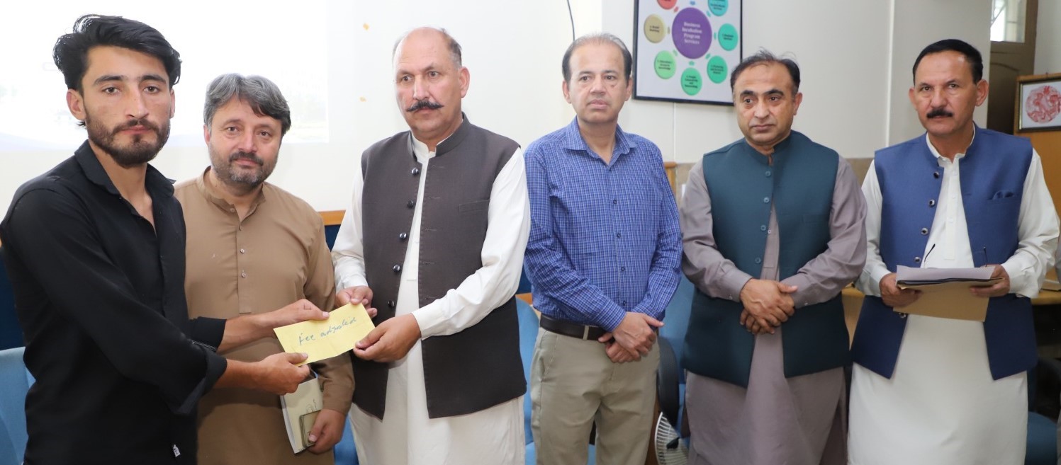 KIU Distributes Cheques Among Flood Affected Students
